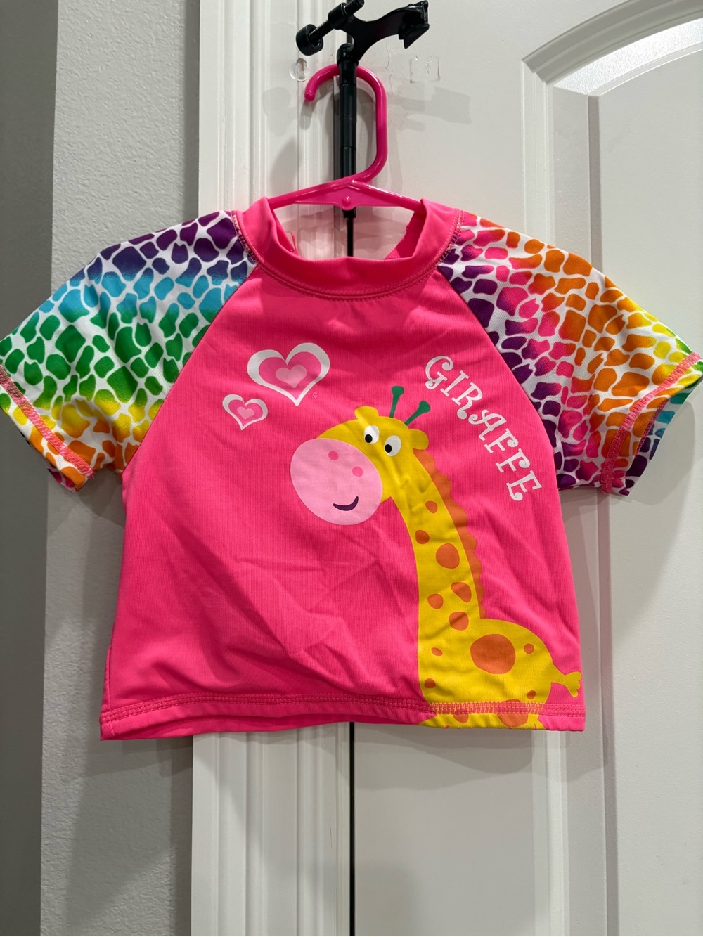 Wippette hot pink with giraffe short sleeve swim top 3T small mark on back